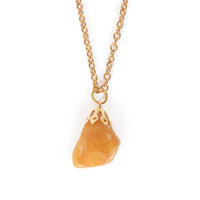 A mid size yellow/gold stone, hanging on gold bail and chain. Image has a solid white background.