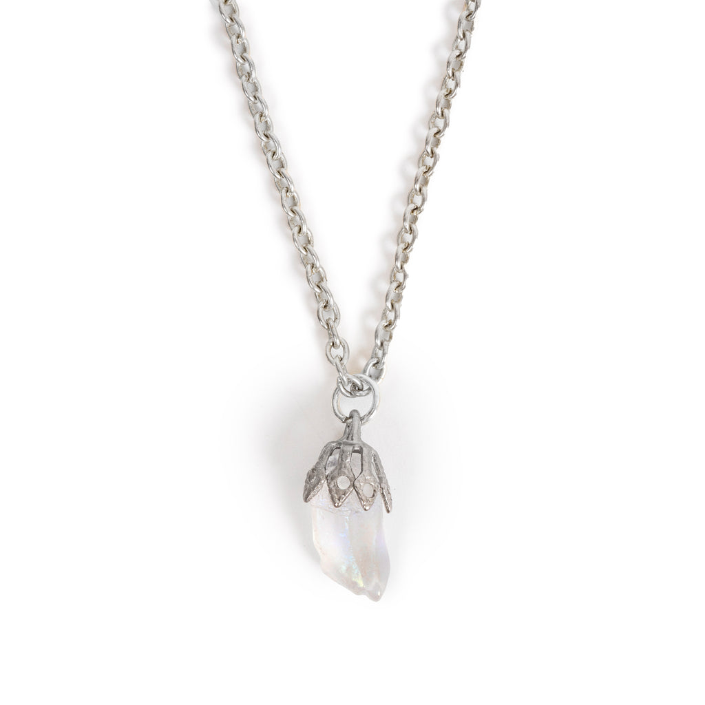A small tumbled moonstone in silver bail on chain, sitting on solid white background.