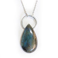 Labradorite teardrop pendant on solid white background