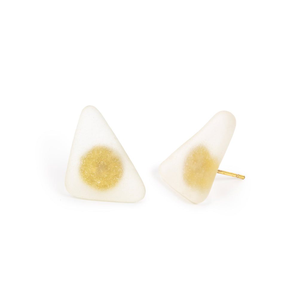 Clear beach glass earrings, with gold posts showing through, sitting on white background. 