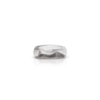 Clear resin ring with black highlight detail, and mix matched shape at top.