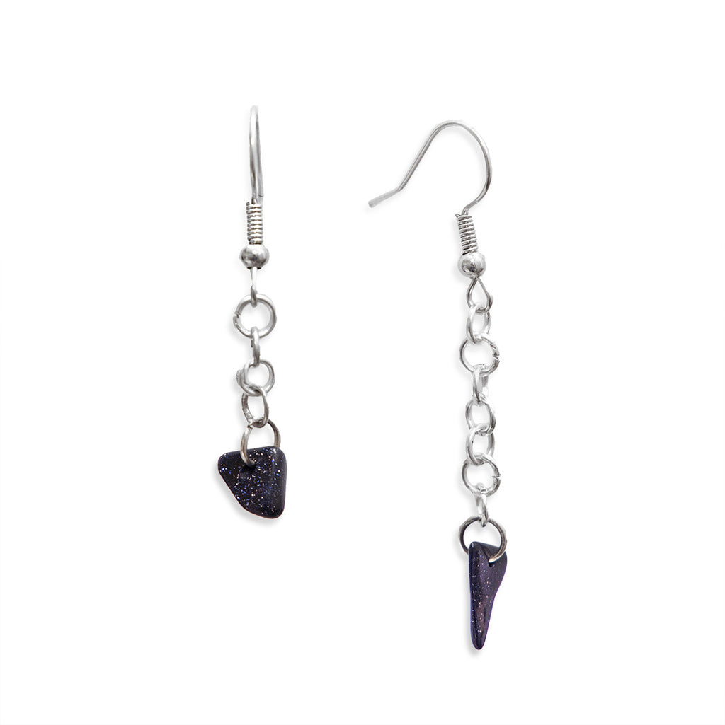 Blue sandstone earrings hanging on silver hooks