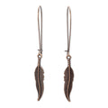 Bronze feather earrings, dangling on long hooks. Shown on solid white background