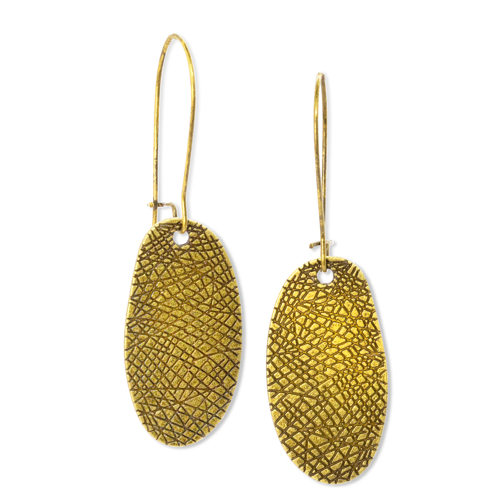 Gold tone textured dangling earrings on solid white background
