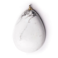 Howlite cabochon on solid white background.