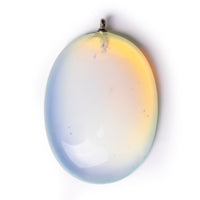 Moonstone cabochon on solid white background.