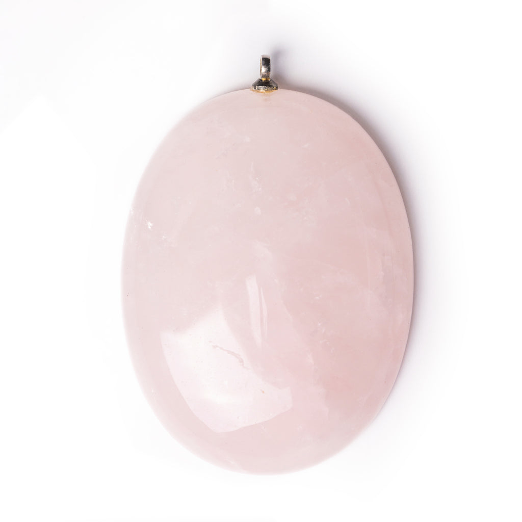 Rose Quartz cabochon on solid white background.