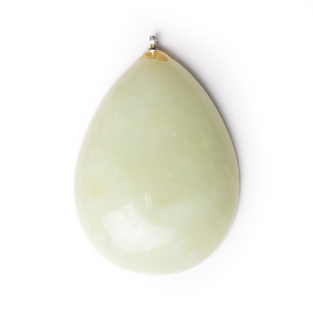 Unknown green gemstone cabochon on solid white background.