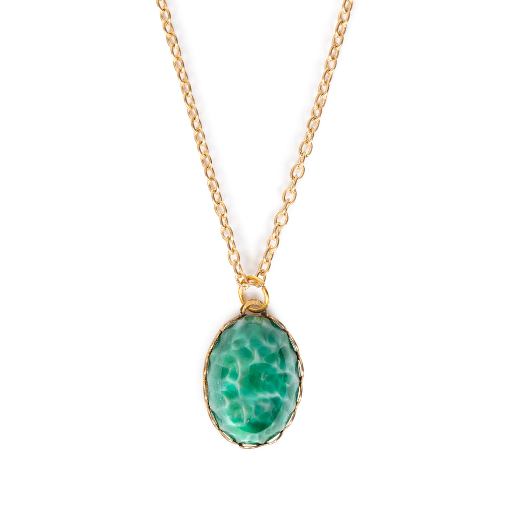 Imitation gemstone on gold cab backing and alloy chain.