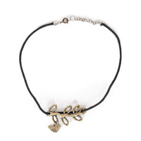 Bird Charm on a branch, on black cording. Choker is on solid white background.