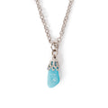 A small tumbled turquoise stone in silver bail on chain, sitting on solid white background.