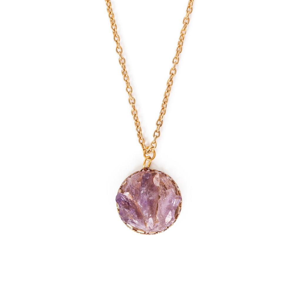 Shards of amethyst in gold backing, hanging on gold chain.