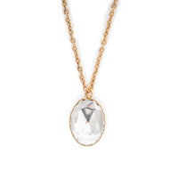Clear glass cabochon on gold chain. Image is on a solid white background.