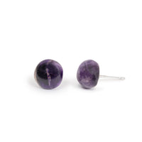 Amethyst cabs on imitation silver posts, sitting on solid white background.