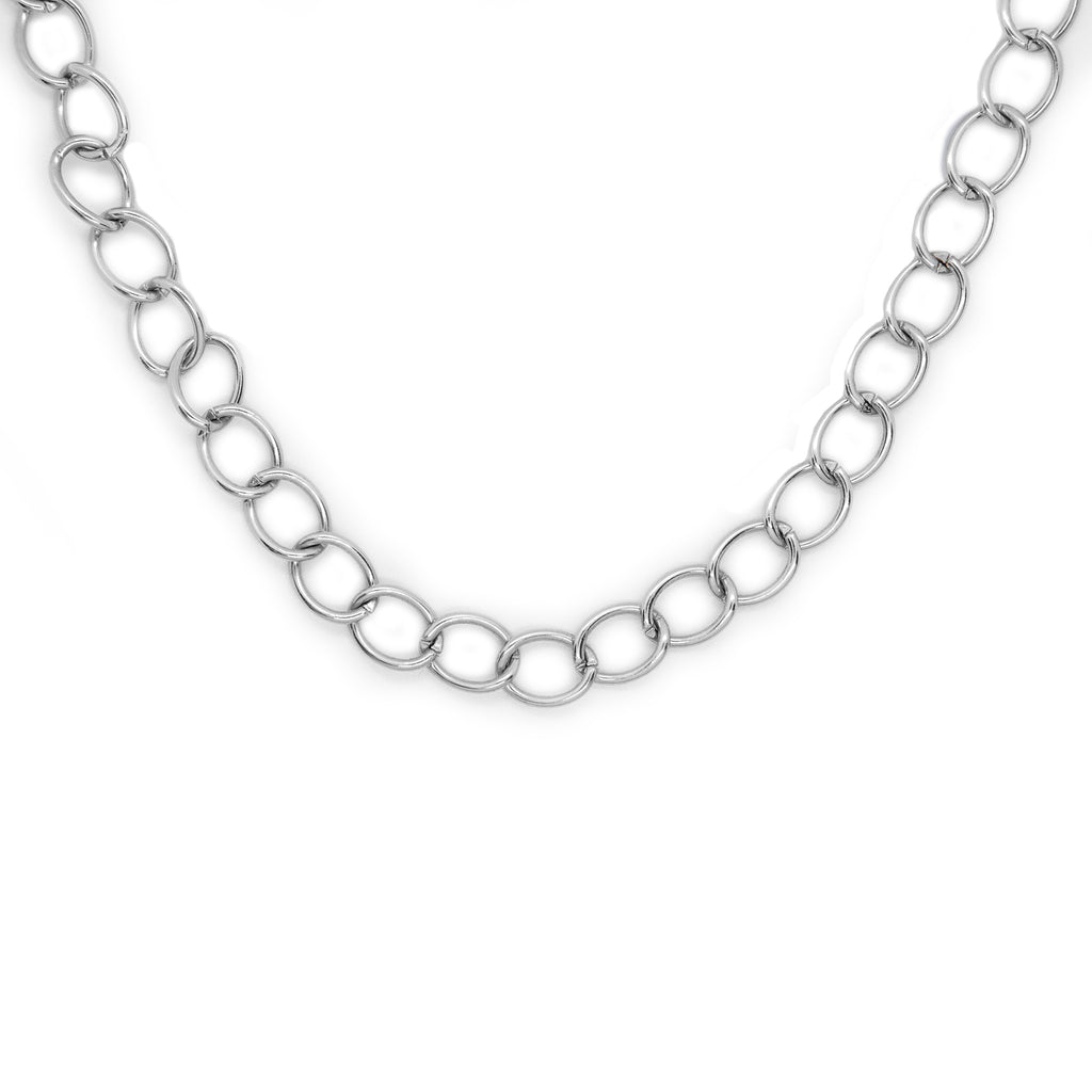 Silver tone lariat style necklace with chain hanging.