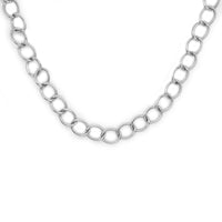 Silver tone lariat style necklace with chain hanging.