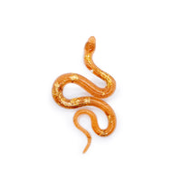Single textured snake epoxy resin earring in orange and gold leaf flake.