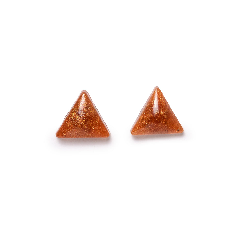 Glittery gold triangle earrings both facing forward, on solid white background.