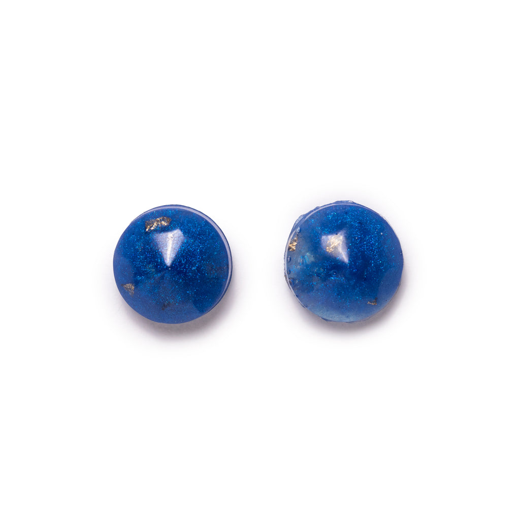 Blue round earrings with gold fleck inside. Image on solid white background.
