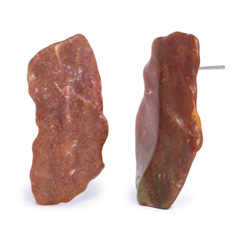 Tall red gemstone earrings on solid white background.