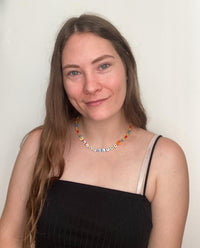 model wearing summer vibes choker, with the name Jocelyn along with smileys.