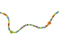 Beaded name choker on white background. Necklace has colorful assorted beads, smiley, heart, "ANNA", another heart and another smile.