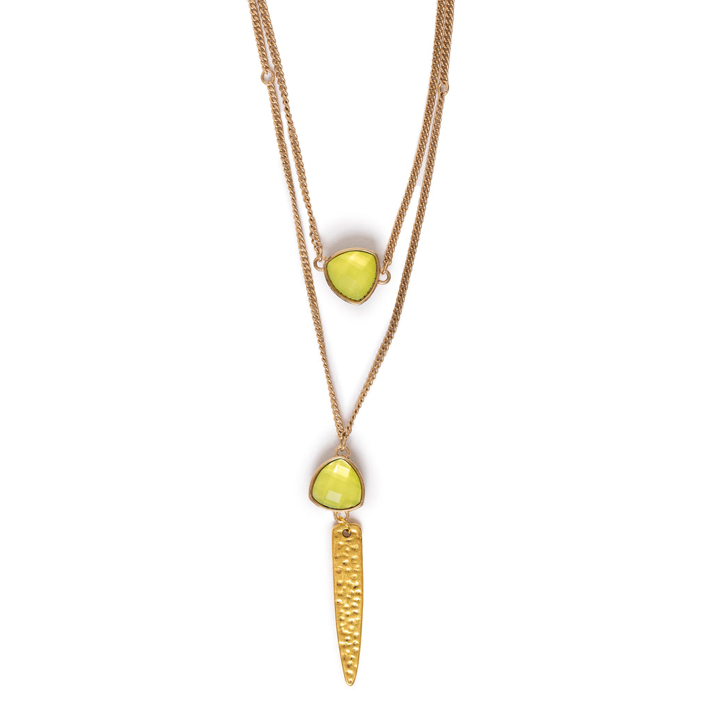 A 2 layered necklace with green charms on gold chain, with a gold hammered long charm at bottom.